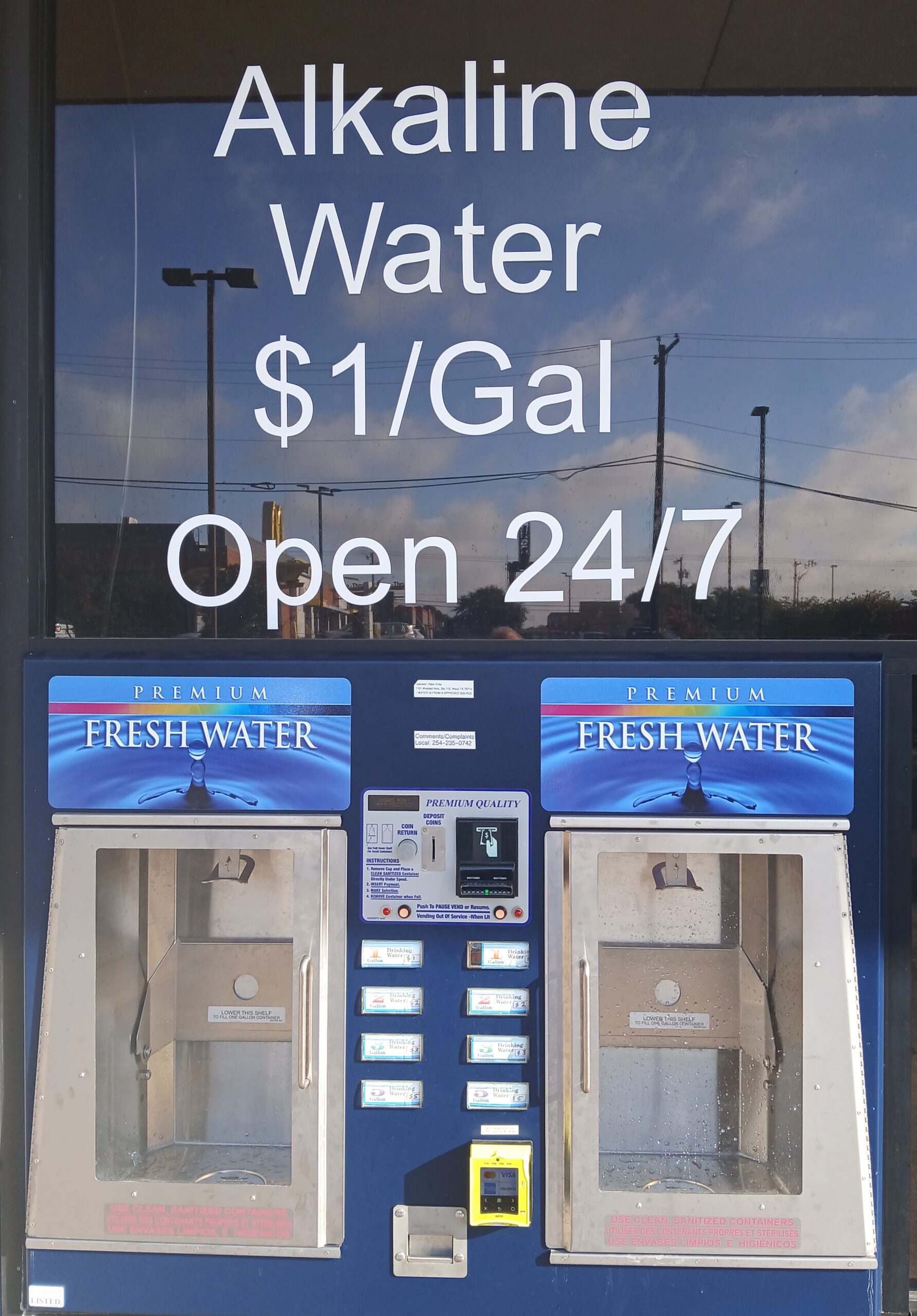 Alkaline water S1/Gal Open 24/7 wordings on the dispenser